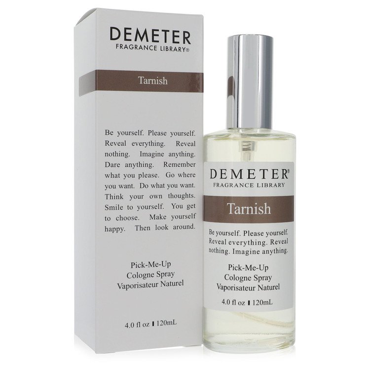 A clear glass bottle with a black cap and white label featuring the Demeter Tarnish Unisex Cologne Spray 4 oz by The Fragranc