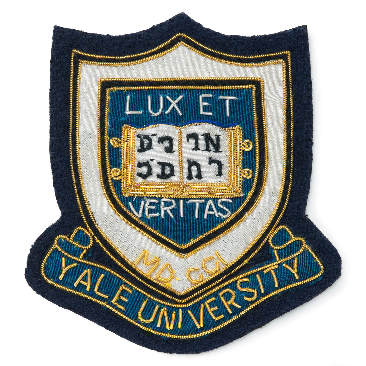 Blue blazer badge with Yale University crest on a dark blue background by Benson & Clegg.