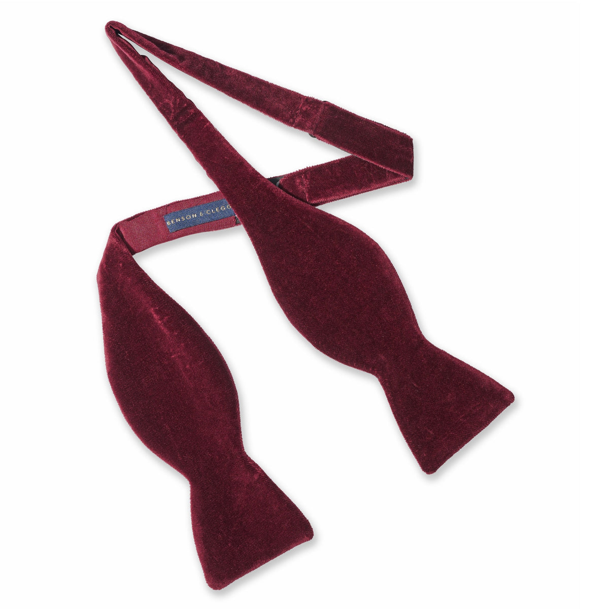 Dark red wine velvet self-tie bow tie with polished edges by Benson & Clegg