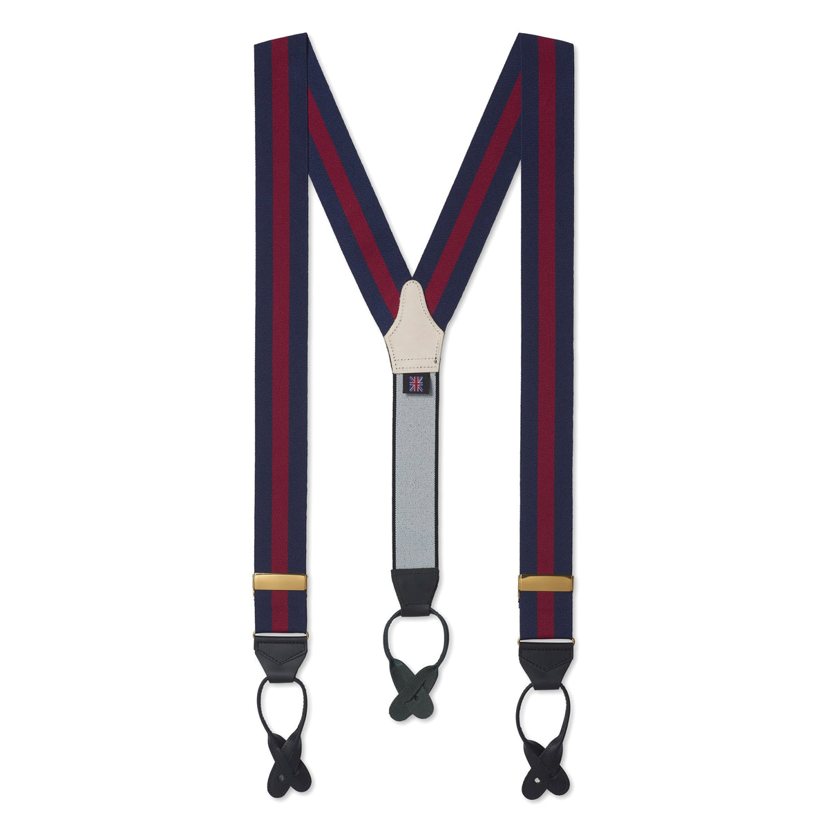 Black leather braces with brass buckles worn on a man's legs by Benson & Clegg.