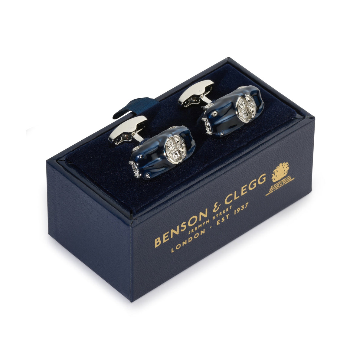 Black metal cufflinks with a sleek design worn on a formal shirt by Benson & Clegg.
