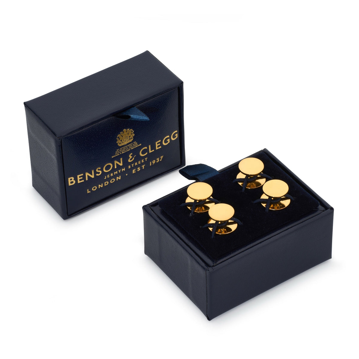 Two gold plated sterling silver dress studs on a white background with a delicate design by Benson & Clegg.