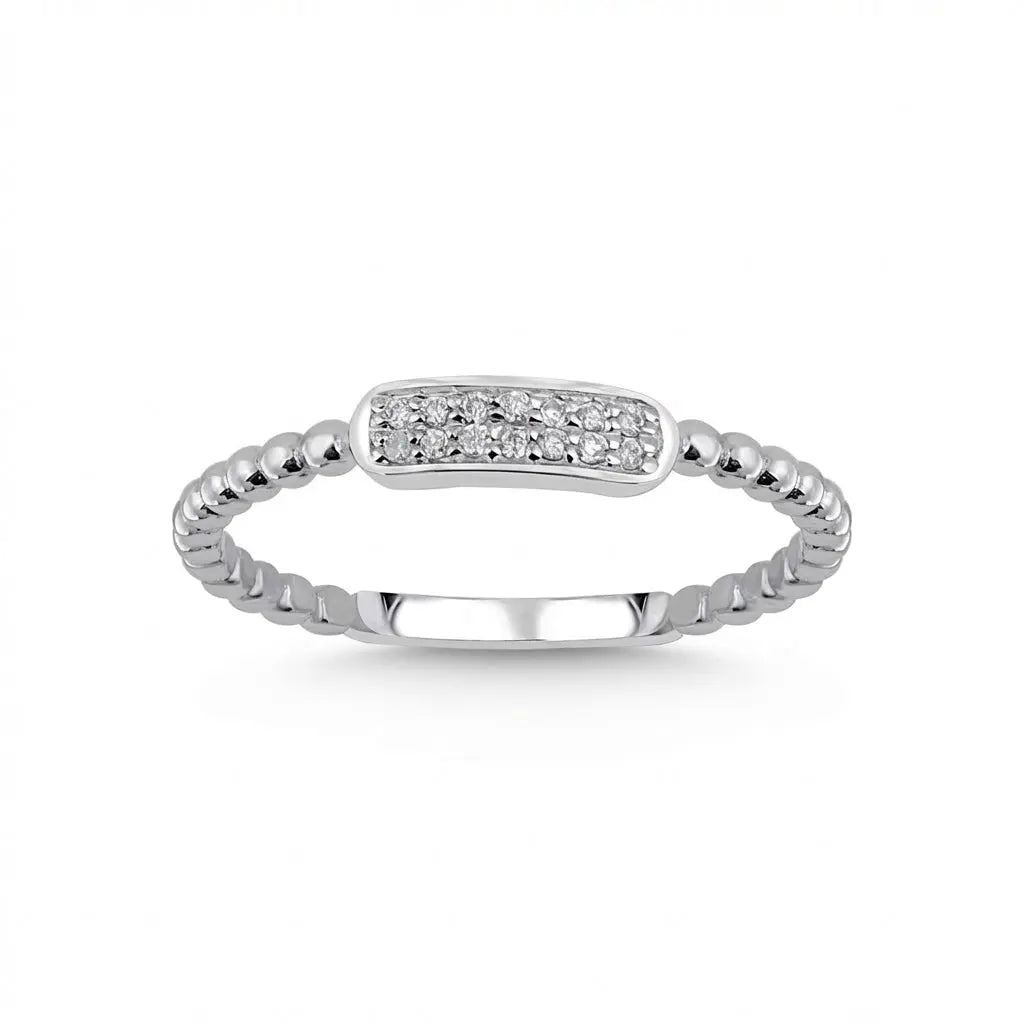 A minimalist 14ct white gold ring featuring a natural diamond bar, set against a soft background by Majestic Jewellery.