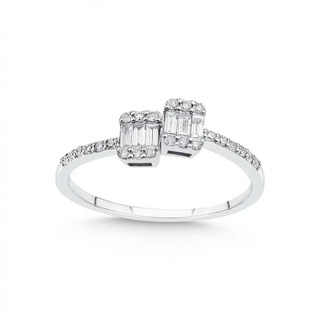 A 14ct white gold ring with two double baguette diamonds and a total of 0.25ct by Majestic Jewellery