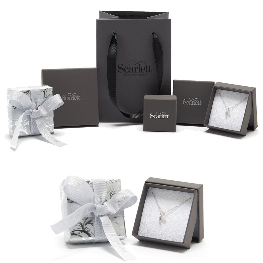 A silver charm bracelet with a heart-shaped charm, displayed on a white background, by Scarlett Jewellery.