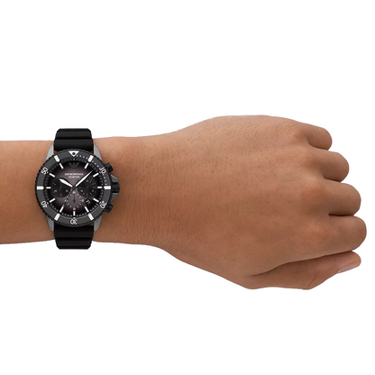 Black and silver diver watch with a sleek design and luminescent hands, featuring the Emporio Armani logo on the dial.