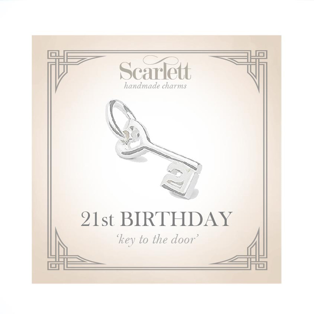 A silver 21st birthday charm with intricate detailing, displayed on a white background by Scarlett Jewellery.
