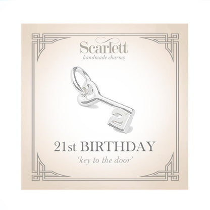 A silver 21st birthday charm with intricate detailing, displayed on a white background by Scarlett Jewellery.