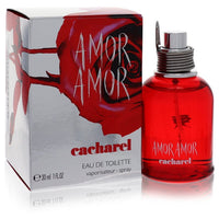 Blue glass bottle of Cacharel Amor Amor Eau De Toilette Spray for Women, 1.7 oz / 50 ml, standing on a white surface by The F