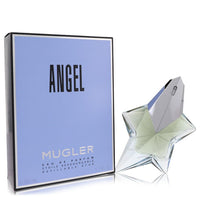 Gold bottle of Thierry Mugler Angel Eau de Parfum Spray Refillable for Women 1.7 oz/50 ml resting on a white surface by The F