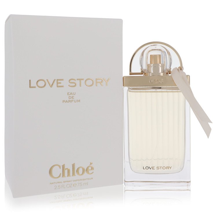 A clear glass perfume bottle with a pink cap and gold accents, labeled Chloe Love Story Eau de Parfum Spray for Women, 1.7 oz