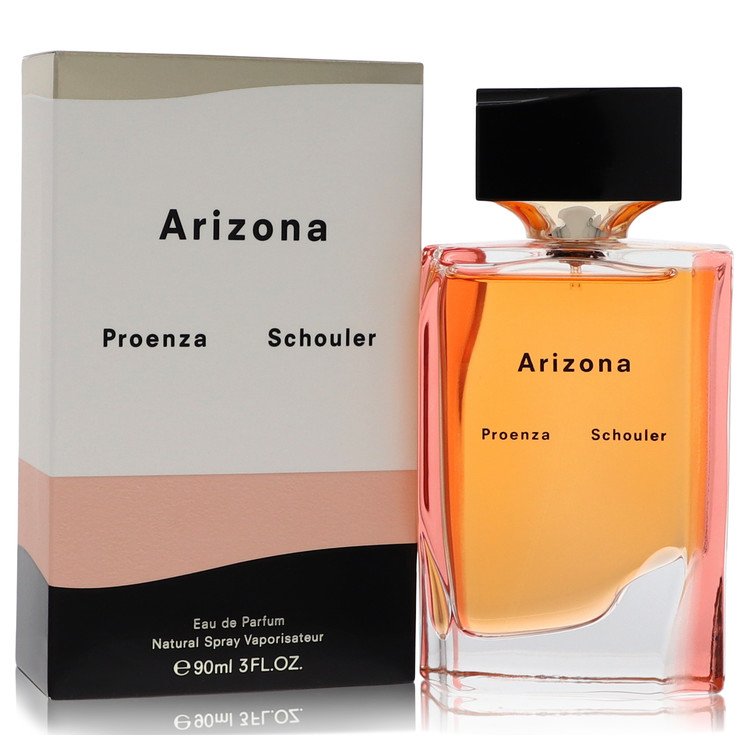 Blue glass bottle with silver cap sitting on a white surface, labeled Proenza Schouler Arizona Eau de Parfum Spray for Women 