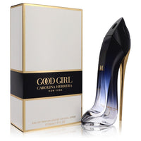 Black bottle with gold accents sitting on a white surface, featuring the Carolina Herrera logo, 1.7 oz eau de parfum spray fo