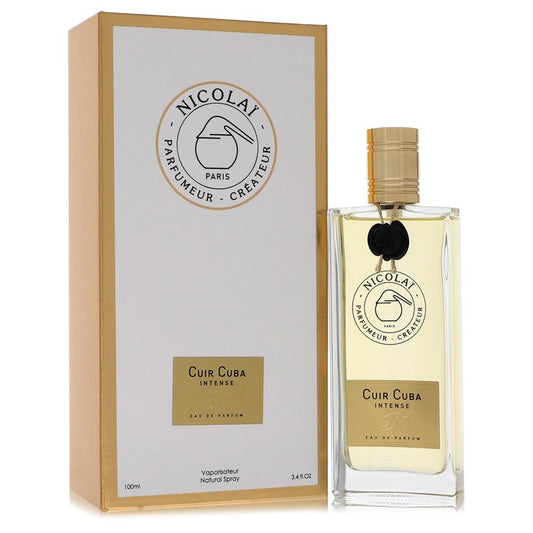 Dark leather bottle with gold cap sitting on a wooden surface by The Fragrance Avenue.