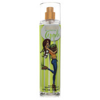 A clear glass bottle of Delicious All American Apple Body Spray with a white label and red accents, displayed on a wooden sur