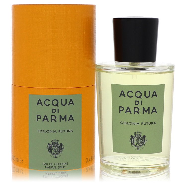 A clear glass bottle with a gold cap and blue label, standing on a white surface, labeled "Colonia Futura" by The Fragrance A