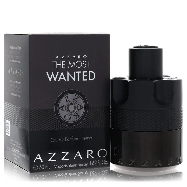 Azzaro The Most Wanted Eau De Parfum Intense spray bottle in black glass with gold accents on a wooden surface by The Fragran