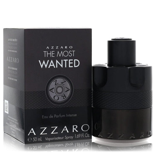 Azzaro The Most Wanted Eau De Parfum Intense spray bottle in black glass with gold accents on a wooden surface by The Fragran