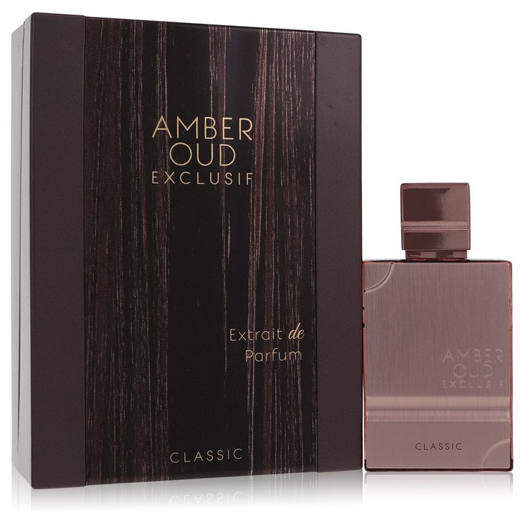 Amber-hued oud perfume bottle with gold accents on a wooden surface by The Fragrance Avenue.