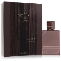 Amber-hued oud perfume bottle with gold accents on a wooden surface by The Fragrance Avenue.