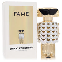 Gold bottle of Paco Rabanne Fame Eau de Parfum Spray 1.7 oz / 50 ml for Women displayed on a white background by The Fragranc