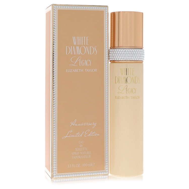 A clear glass bottle with a white diamond design and gold accents, standing on a white surface, labeled "Elizabeth Taylor Whi