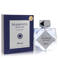 A clear glass bottle with gold accents and a white label featuring the name Diamonte on a light blue background, 3.3 oz eau d