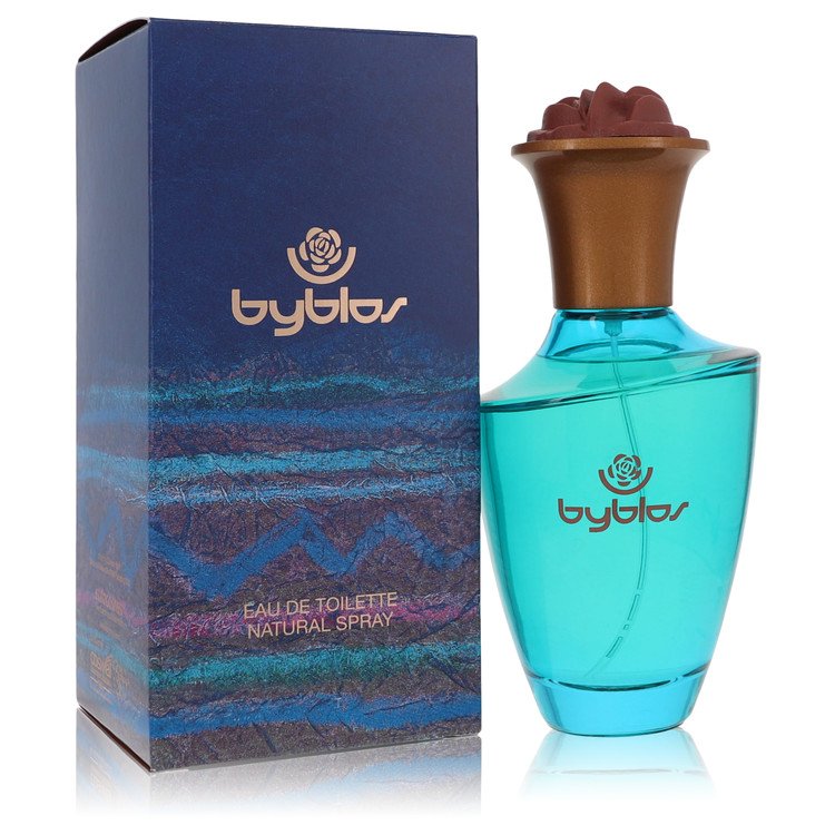Blue glass bottle with white label featuring the brand name, standing on a wooden surface. Byblos by Byblos Eau de Toilette S