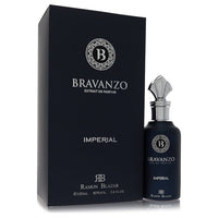 A dark glass bottle with gold lettering labeled Dumont Bravanzo Imperial by Dumont Paris on a wooden surface.
