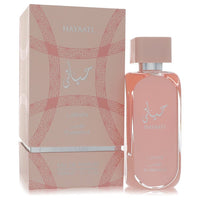 A clear glass bottle with a white label and gold accents, featuring the Lattafa Hayaati Florence unisex eau de parfum spray 3