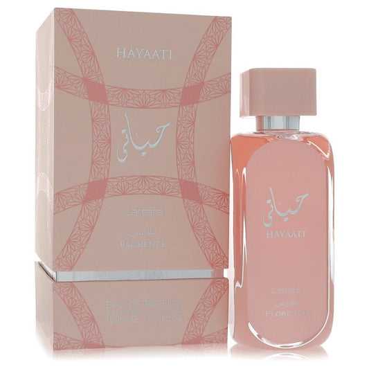 A clear glass bottle with a white label and gold accents, featuring the Lattafa Hayaati Florence unisex eau de parfum spray 3