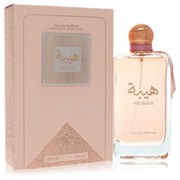 A clear glass perfume bottle with gold accents and a black cap, labeled Al Zaafaran Heibah Women's Eau De Parfum Spray by The