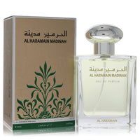 Blue glass bottle of Al Haramain Madinah Eau De Parfum Spray unisex 3.33 oz (100 ml) by The Fragrance Avenue