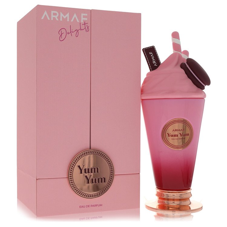 A pink and gold perfume bottle with a floral design on a white background by The Fragrance Avenue