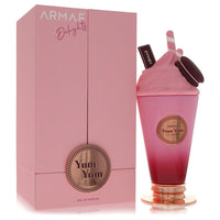 A pink and gold perfume bottle with a floral design on a white background by The Fragrance Avenue