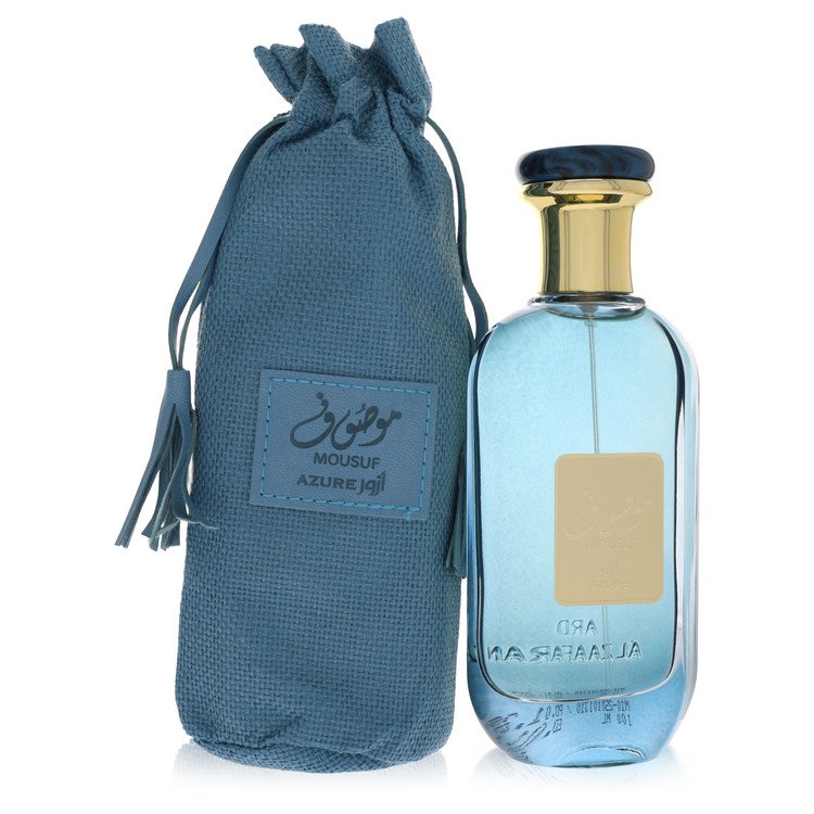 Blue glass bottle with gold accents featuring a minimalist design, labeled Al Zaafaran Mousuf Azure unisex eau de parfum 3.4 