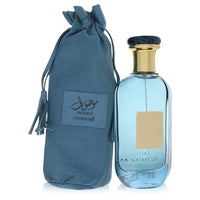 Blue glass bottle with gold accents featuring a minimalist design, labeled Al Zaafaran Mousuf Azure unisex eau de parfum 3.4 