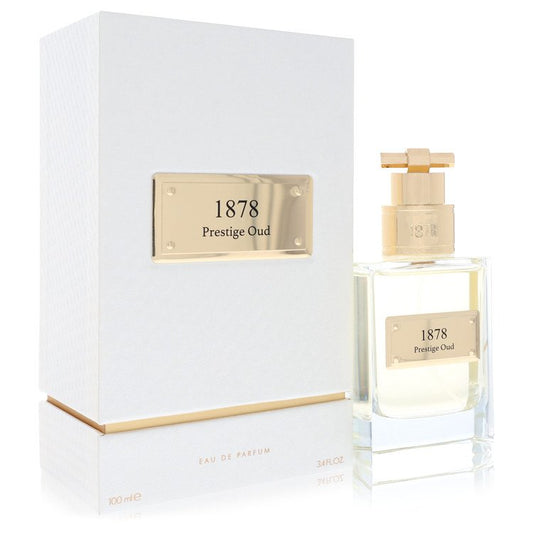 Atralia Prestige Oud Eau De Parfum Spray in a sleek black bottle with gold accents, displayed on a wooden surface by The Frag