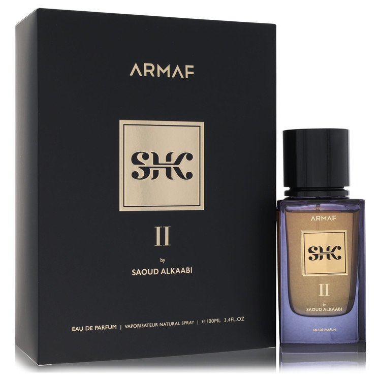 Blue glass bottle of Armaf Eau De Parfum Spray SHK II by Saoud Alkaabi for Men on a wooden surface with a black label and gol