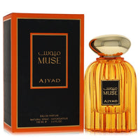 A glass perfume bottle with gold accents and a white label featuring the name Ajyad Muse on a neutral background by The Fragr