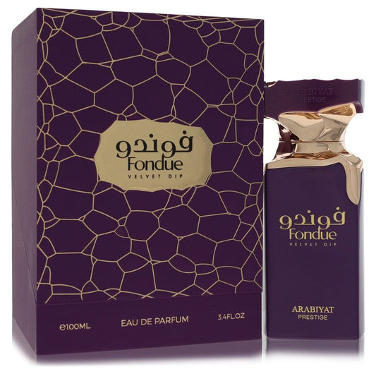 A vertical velvet bottle of Arabiyat Prestige Fondue Velvet Dip Eau de Parfum Spray in gold accents for women by The Fragranc