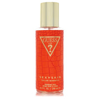 Blue glass bottle of Guess Sexy Skin Solar Warmth fragrance mist 8.4 oz for women by The Fragrance Avenue