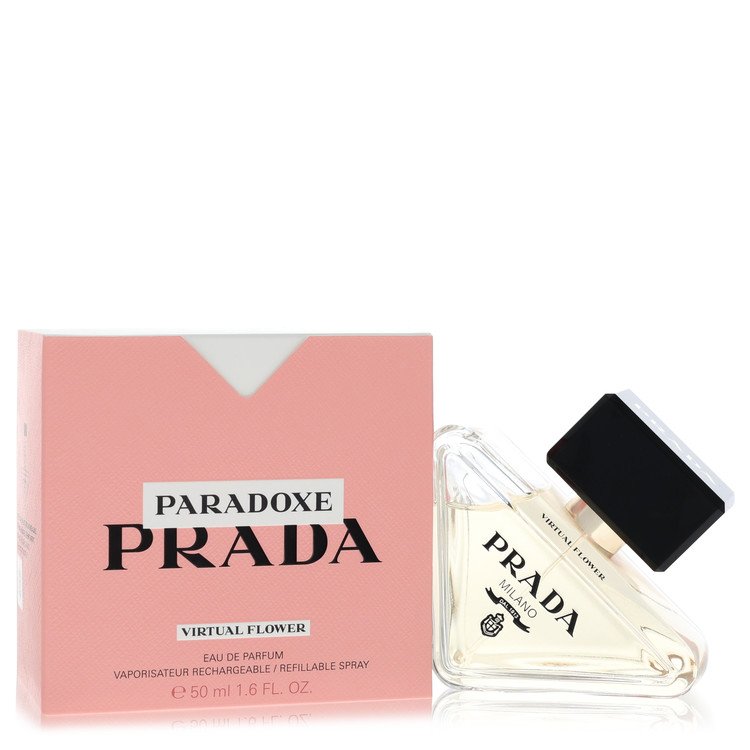 A white glass bottle with a pink flower design and gold accents, displayed on a black surface, labeled "Prada Paradoxe Virtua