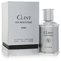 A blue glass bottle of L'Orientale Clint Ice Mountain Eau de Parfum Spray for Men on a wooden surface by The Fragrance Avenue