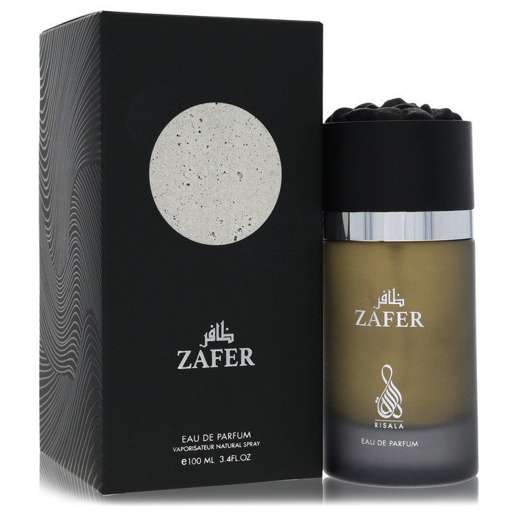 Blue glass bottle with black cap, standing on a wooden surface, labeled Risala Eau De Parfum Spray for Men by The Fragrance A