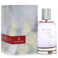 Blue glass bottle with white label featuring a forget me not flower design, 3.4 oz eau de toilette for women by The Fragrance
