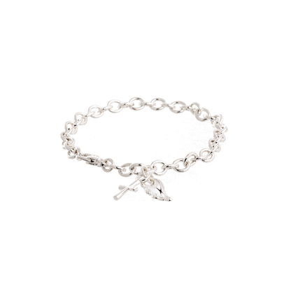 Silver charm bracelet featuring a hand and cross charm, showcasing intricate links and elegant design by Scarlett Jewellery.