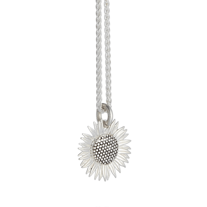 Sunflower silver charm with detailed petal texture, displayed on a soft background by Scarlett Jewellery.