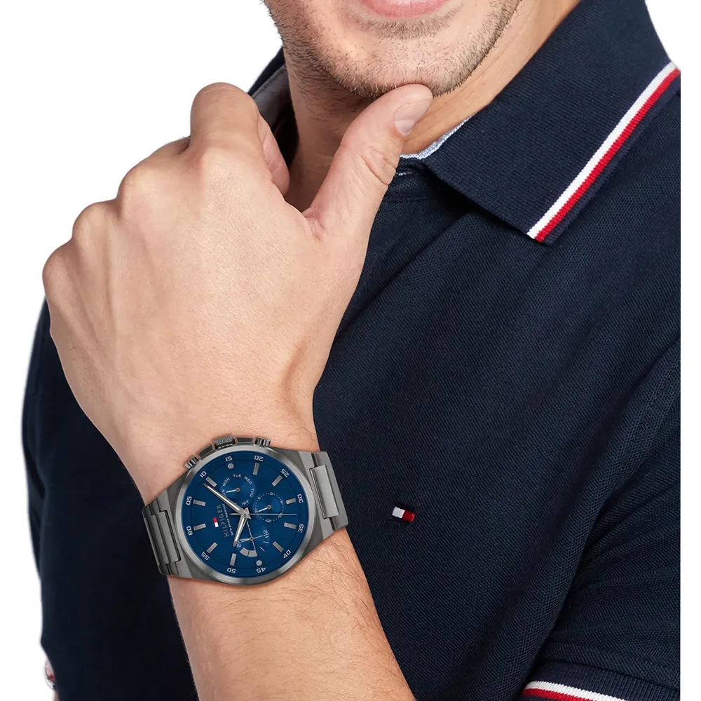 Tommy Hilfiger men's watch with gunmetal steel case and black dial, viewed from the front.