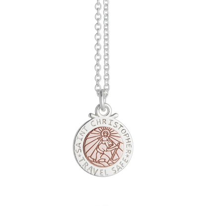 A silver and rose gold St Christopher necklace with personalized engraving, displayed on a soft white background by Scarlett 